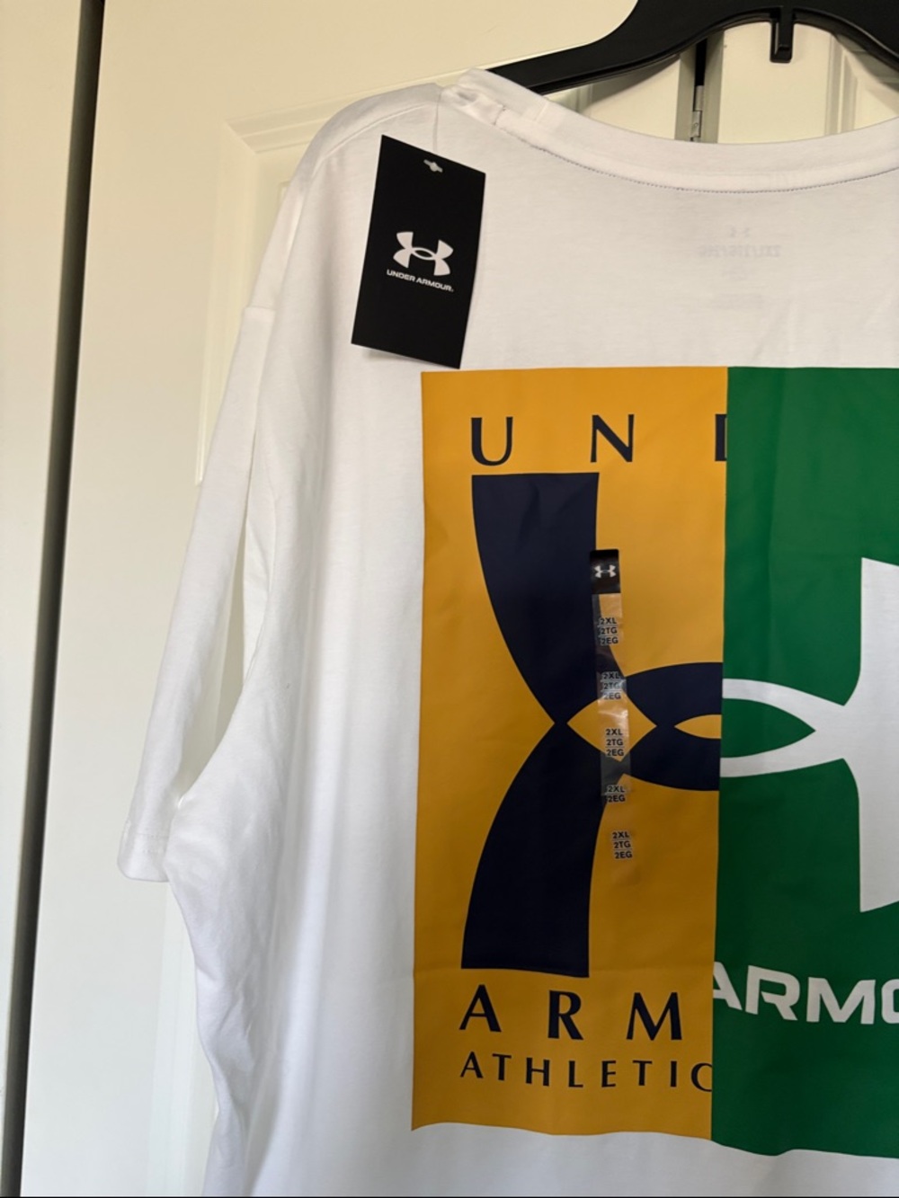 Under Armour White Short Sleeve Tee with Green & Yellow Logos - Picture 9 of 10